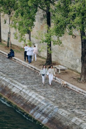 Photo for Paris, France - 26.09.2021 : People stroll along the banks of the Seine - Royalty Free Image