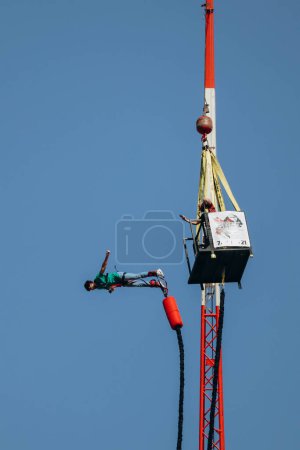 Photo for Bungee jumping from a great height while connected to a large elastic cord - Royalty Free Image