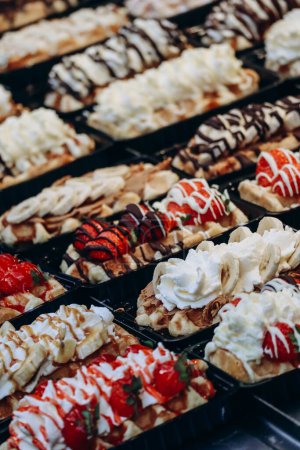 Photo for Traditional Belgian waffles with different toppings - Royalty Free Image