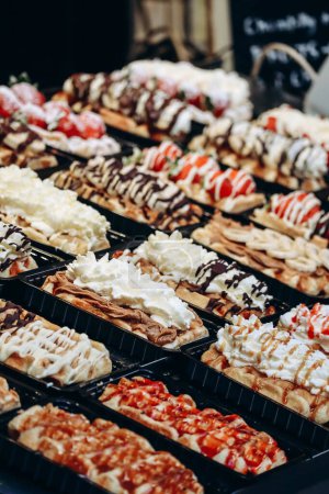 Photo for Traditional Belgian waffles with different toppings - Royalty Free Image