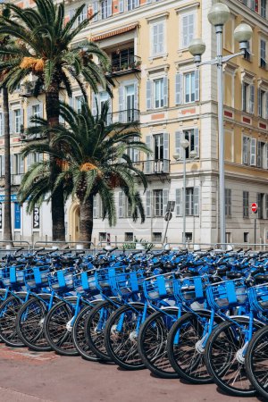 Photo for Nice, France - September 17, 2023: Blue bicycles for rent "Velo Bleu" in Nice on the Promenade des Anglais - Royalty Free Image