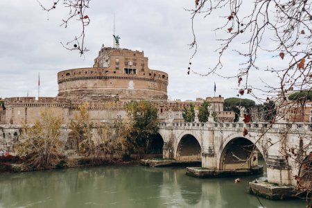 Photo for St. Angelo Bridge and Castel Sant'Angelo in Rome on a cloudy December day - Royalty Free Image