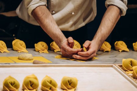 Photo for The chef prepares the cappellacci with ricotta and spinach - Royalty Free Image