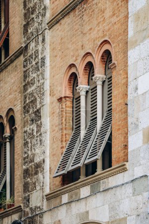 Close-up of a historic facade in the center of Pisa, in Tuscany, central Italy