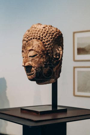 Nice, France - 19 November 2023 : Buddha head. From the Kingdom of Ayutthaya, Thailand, 2nd half of the 14th century, sandstone, traces of gilding.