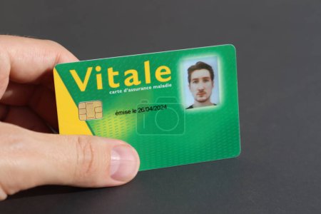 Young man's health insurance card of the national health care system in France, named Carte Vitale (translation "Vital card")