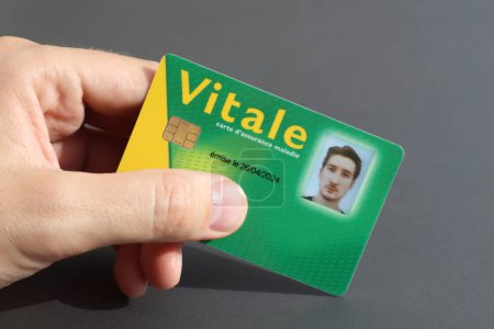 Young man's health insurance card of the national health care system in France, named Carte Vitale (translation "Vital card")