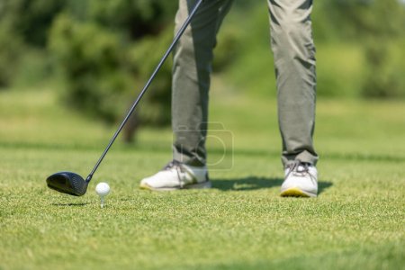 Photo for Golf course green. Golfer hits the ball with a club on the golf course - Royalty Free Image