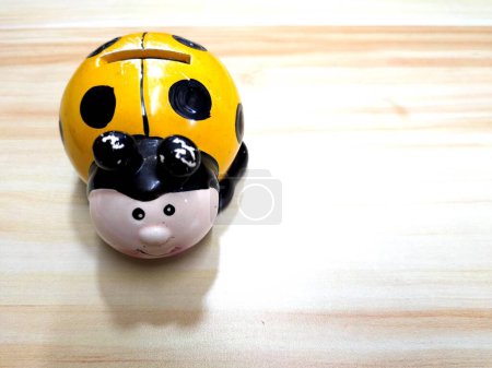 Photo for Yellow Ceramic Ladybug  Coin Box - Royalty Free Image