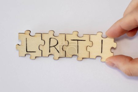 Photo for Lower Respiratory Tract Infections - LRTI. Lettering on wooden puzzles. - Royalty Free Image