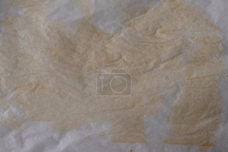 Foto de Old soiled used parchment for cooking. Background. - Imagen libre de derechos