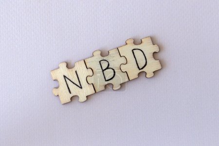 Foto de El acrónimo NBD, que significa No Big Deal. Las cartas escritas en los puzzles - Imagen libre de derechos