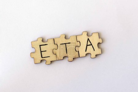 Photo for The acronym ETA, which stands for Estimated Time of Arrival. The letters written on the puzzles - Royalty Free Image