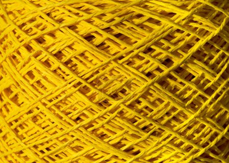Raffia is yellow. Close-up of a skein of ECO raffia. Crochet. Eco material for handmade work.