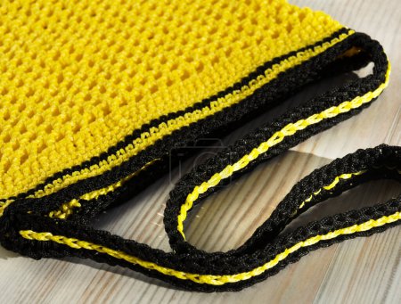 Yellow bag. Women's bag made of polyester cord for a table. String bag for groceries.