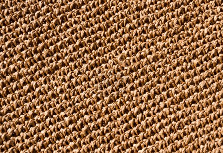 Raffia knitting texture close-up. Crochet from ECO material. Handmade.