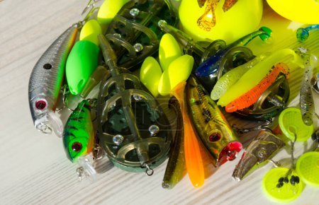 Fishing tackle on a wooden background. Background for a fishing theme.
