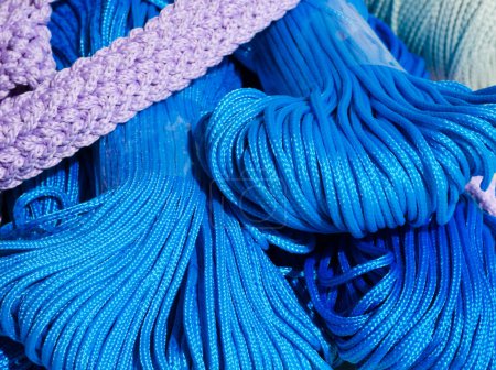 Blue polyester cord in skeins. Synthetic cord for knitting bags and baskets.
