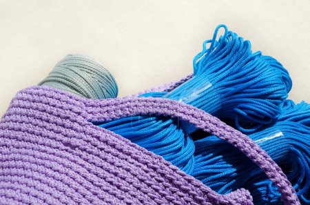 Crochet pattern using polyester cord. Bright blue cord for knitting bags, baskets and string bags.