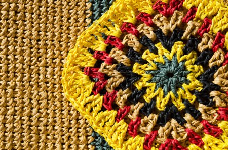 Raffia. Grandmother's Square. Raffia crochet texture. Eco-friendly handmade material. Crocheted bags, clutches, hats, wallets.