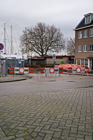 Foto de Road Closed due to flooded street, high water caused by storm Henk. Sandbags and big bags placed by the government to protect homes against water damage. City Hoorn, Netherlands 01-05-2024. - Imagen libre de derechos