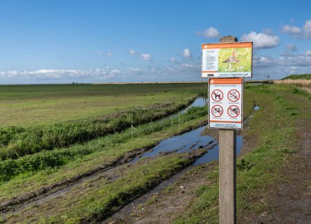 Temporary no entry sign on the side of a dirt road by nature reserve bird sanctuary, indicating prohibited access during the breeding season in Schellinkhout, North Holland Netherlands 18 april 2024.