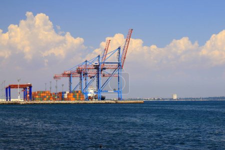 Photo for Seaport Odessa, Ukraine. Export of grain from Ukraine. Cranes load ships, containers in sea port of Odesa. Grain agreement, delivery of goods, food, agricultural products - Royalty Free Image