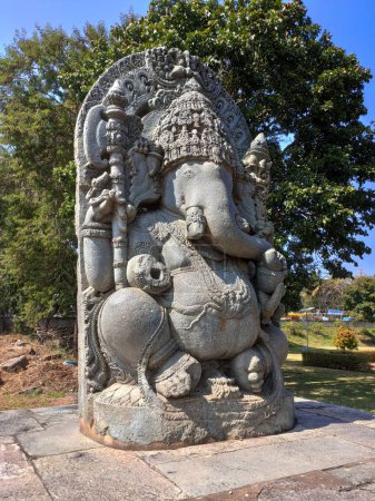 Photo for 12th-century Ganesha statue outside Shaivism Hindu temple Hoysaleswara arts Halebidu, Karnataka State, India - Royalty Free Image