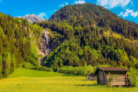 Alpine farm in Green Stubai valley near Innsbruck at sunset, Tyrol, Austria