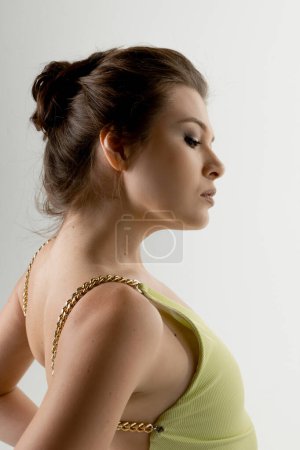 Photo for Portrait of fashionable  young  woman posing in studio - Royalty Free Image