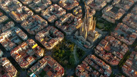Photo for Aerial view of Barcelona skyline and Sagrada Familia Cathedral. Eixample residential famous urban grid. Cityscape with typical urban octagon blocks - Royalty Free Image