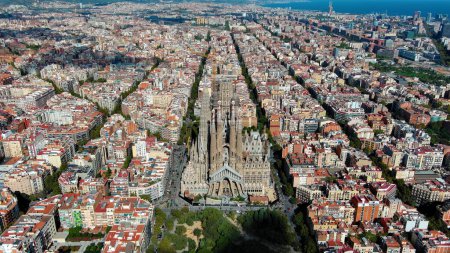 Photo for Aerial view of Barcelona city skyline, Sagrada Familia Basilica and Eixample residential district. Sunny day, Catalonia, Spain - Royalty Free Image