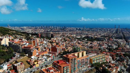 Aerial view of Barcelona city skyline, Sagrada Familia Basilica and Eixample residential district. Sunny day, Catalonia, Spain