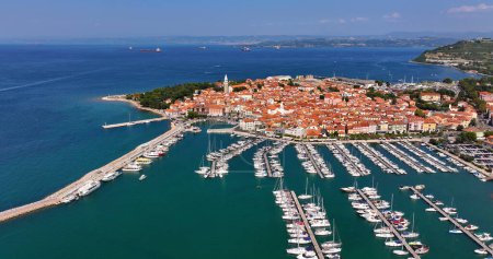 Aerial view of the old fishing town, Izola, on an impressive summer day in Slovenia, Europe. Beautiful seascape of the Adriatic Sea