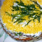 mimosa layered salad made of diced vegetables, canned fish, mayonnaise decorated with crumbled eggs, russian ukrainian cuisine, post soviet countries new year celebration festive salad
