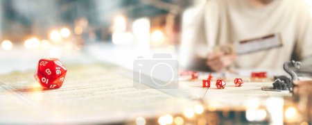 Photo for Role playing tabletop and board game hobby concept. D12 dice place on character sheets for create begin fantasy and adventure blur book and miniatures. Banner size background. - Royalty Free Image