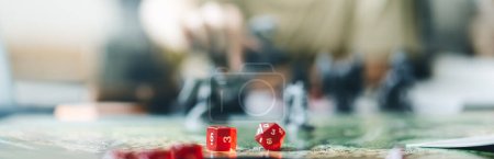 Photo for Role playing tabletop and board game hobby concept. Dice place on character sheets for create begin fantasy and adventure blur book and miniatures. Banner size background. - Royalty Free Image