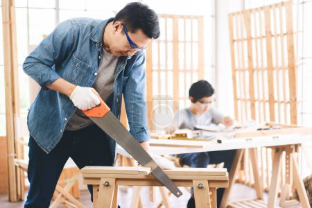 Photo for Southeast asian family father and son diy or repair at home concept. Dad teach using tools about carpenter or engineer education skill with child at workshop. - Royalty Free Image