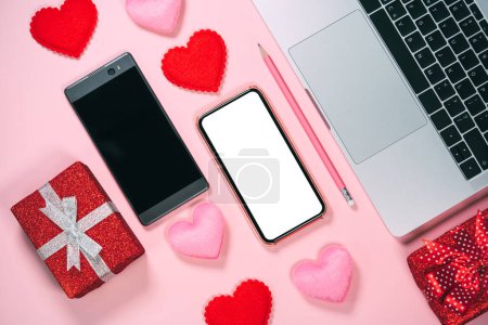 Photo for Dating app couple via internet online concept. Two smart phone with red heart blank screen for mock up or copy space. Valentine day pink theme color background. - Royalty Free Image
