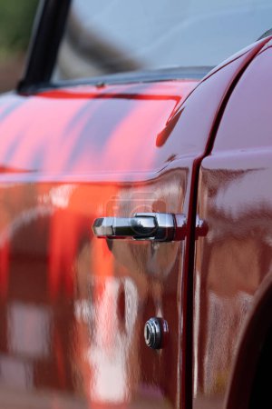 Classic Red Hot Rod: Vintage Elegance in Motion with Shiny Details and Chrome Accents