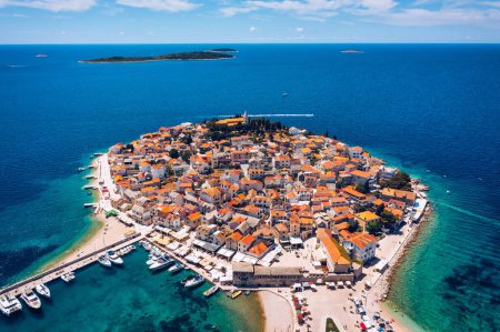 Photo for Aerial view of Primosten old town on the islet, Dalmatia, Croatia. Primosten, Sibenik Knin County, Croatia. Resort town on the Adriatic coast. Aerial view of adriatic town Primosten, Croatia - Royalty Free Image
