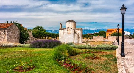 Photo for Nin town and Church of the Holy Cross is a Croatian Pre-Romanesque Catholic church originating from the 9th century in Nin, Croatia - Royalty Free Image