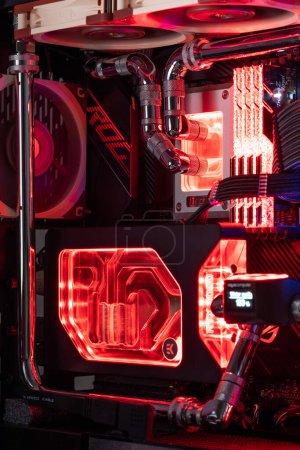 Photo for Prague, Czech Republic - 21 July 2021: Close-up of high performance Desktop PC and water cooling system with multicolored LED RGB light show status on working, interior on Computer PC Case and DIY - Royalty Free Image