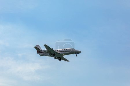 Photo for Landing airplane. Landscape with passenger airplane is flying in the blue sky with clouds. Passenger airliner. Business trip. Commercial aircraft. Passenger airplane flying and getting ready to land. - Royalty Free Image