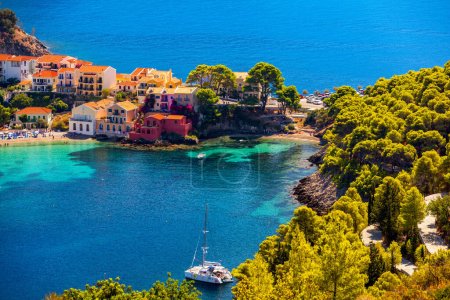 Photo for Assos village in Kefalonia, Greece. Turquoise colored bay in Mediterranean sea with beautiful colorful houses in Assos village in Kefalonia, Greece, Ionian island, Cephalonia, Assos village. - Royalty Free Image