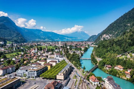 Photo for Aerial view over the city of Interlaken in Switzerland. Beautiful view of Interlaken town, Eiger, Monch and Jungfrau mountains and of Lake Thun and Brienz. Interlaken, Bernese Oberland, Switzerland. - Royalty Free Image