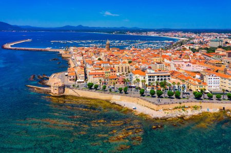 Photo for Aerial view over Alghero old town, cityscape Alghero view on a beautiful day with harbor and open sea in view. Alghero, Italy. Panoramic aerial view of Alghero, Sardinia, Italy. - Royalty Free Image
