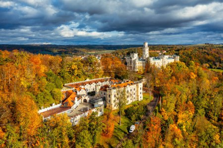 Photo for Castle Hluboka nad Vltavou is one of the most beautiful castles in Czech Republic. Castle Hluboka nad Vltavou in autumn with red foliage, Czechia. Colorful autumn view of Hluboka nad Vltavou castle. - Royalty Free Image
