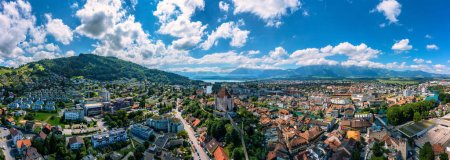 Photo for Panorama of Thun city with Alps and Thunersee lake, Switzerland. Historical Thun city and lake Thun with Bernese Highlands swiss Alps mountains in background, Canton Bern, Switzerland. - Royalty Free Image