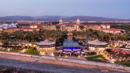 Aerial drone of the popular resort town of Meloneras, with hotels and restaurants, near the Maspalomas dunes in Gran Canaria, Canary Islands, Spain